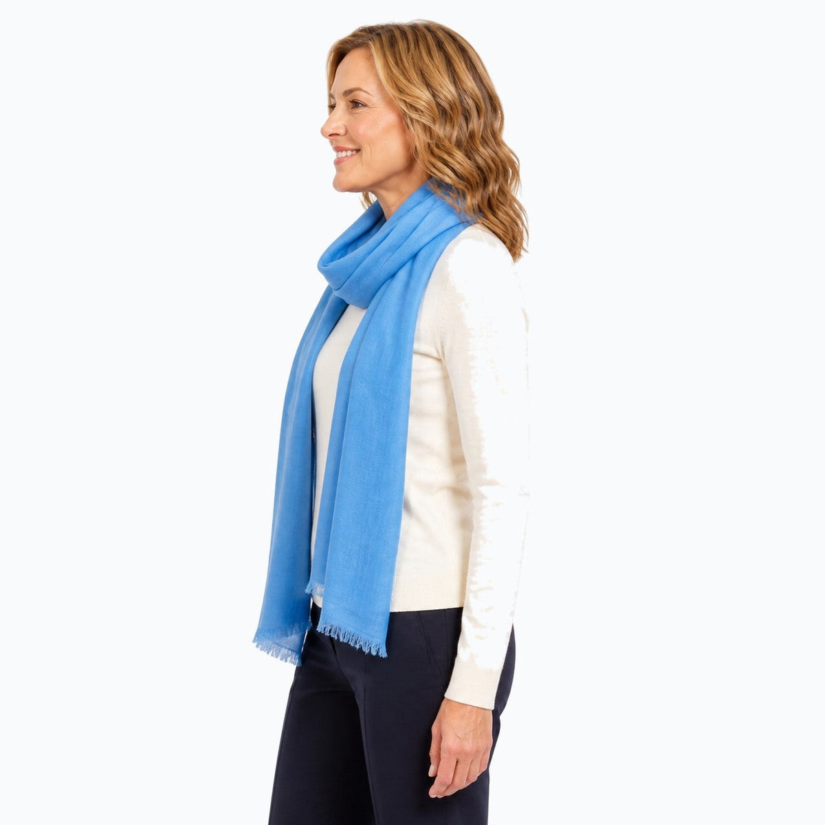 Woman wearing the Claire Powell Denim Blue Silk Wool Scarf, side view