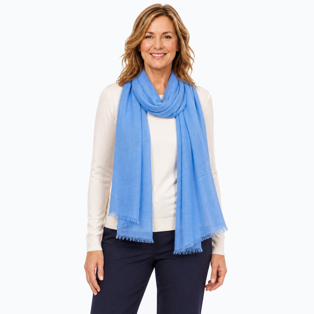 Woman wearing the Claire Powell Denim Blue Silk Wool Scarf, three-quarter view