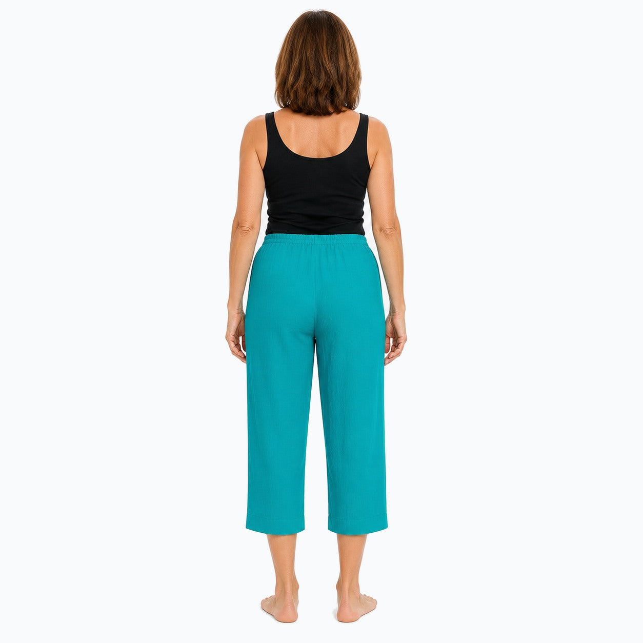 Woman wearing the Claire Powell Jade Viscose 7/8 Pants, back view