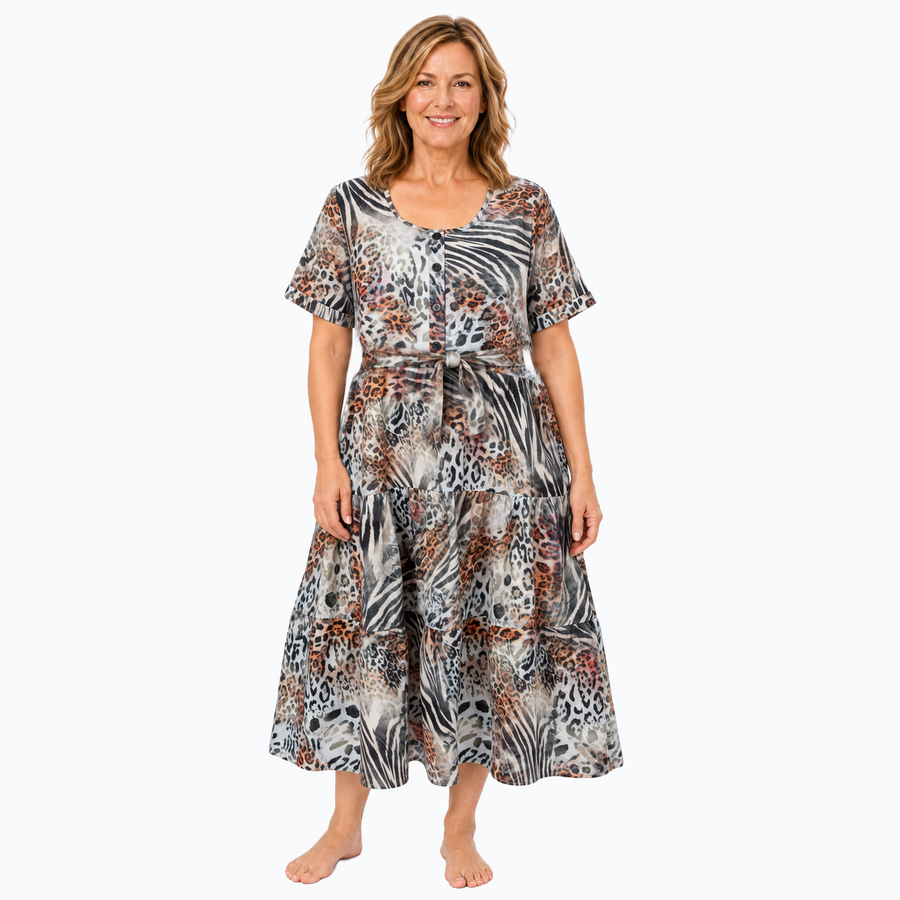 Model D wearing the Claire Powell Tiered A-line Midi Dress in Jungle with matching-fabric tie belt, front view