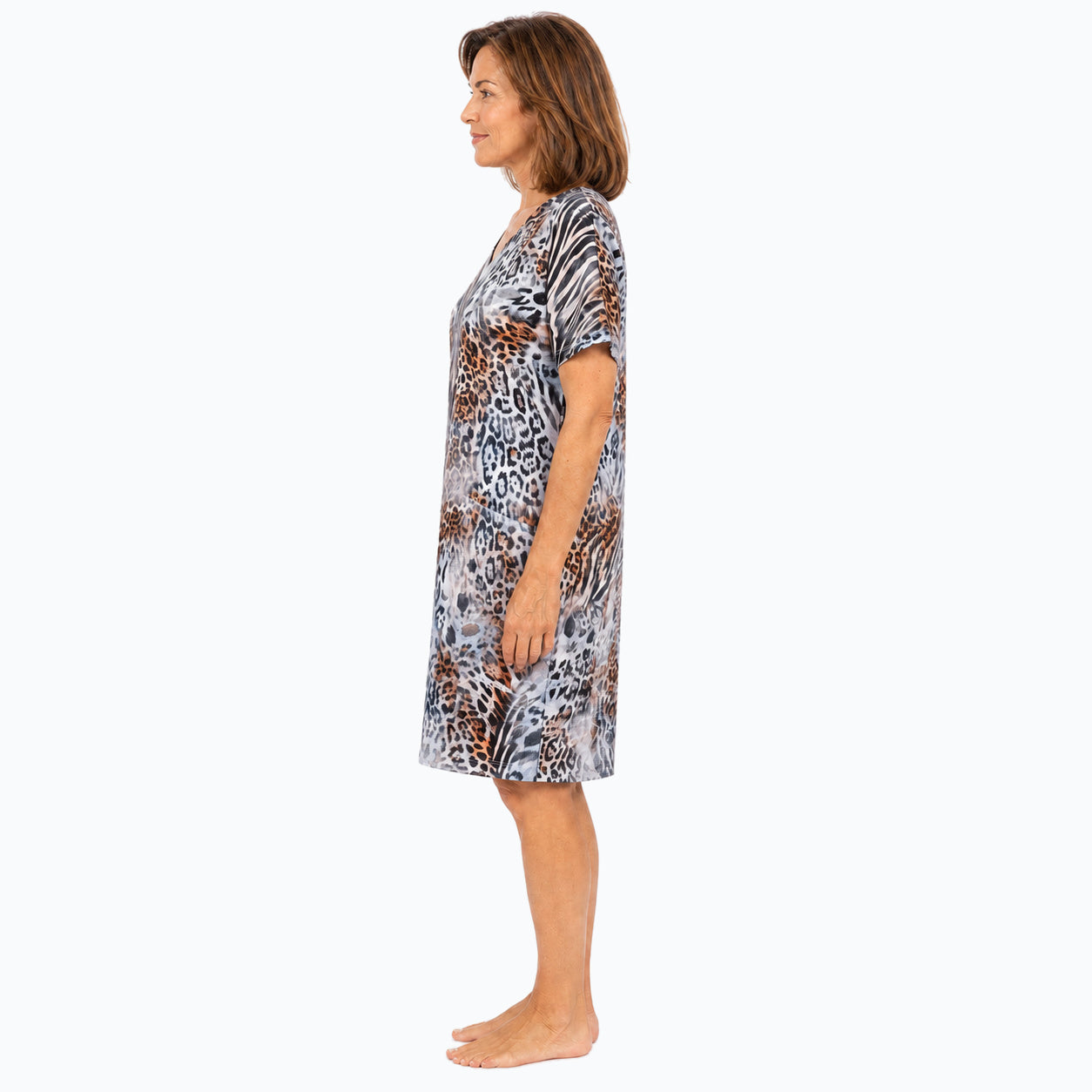 Woman wearing the Claire Powell Jungle Shift Dress, side view