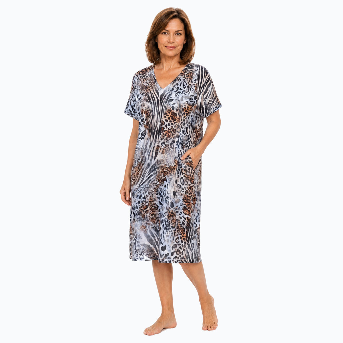 Woman wearing the Claire Powell Jungle Shift Dress, three-quarter view