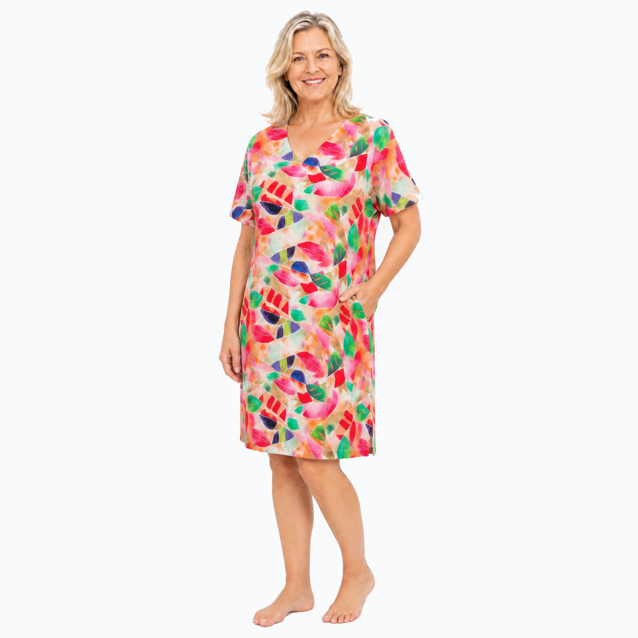 Woman wearing the Claire Powell La Peach Shift Dress, three-quarter view