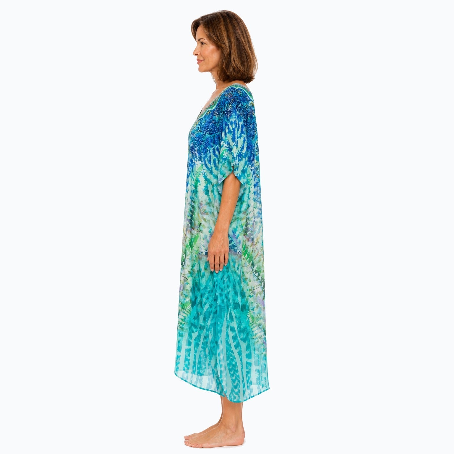 Claire Powell Marine midi kaftan dress on a mature woman, side view