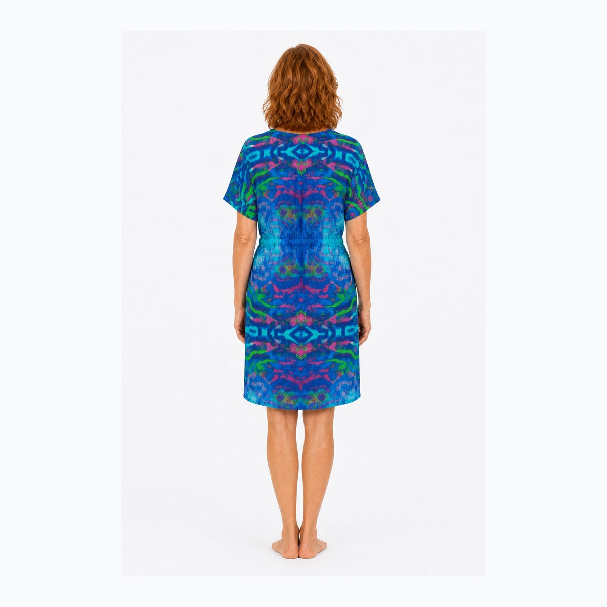 Woman wearing the Claire Powell Mirage Shift Dress, back view