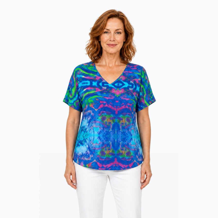 Woman wearing the Claire Powell Mirage V-Neck T-Shirt, front view