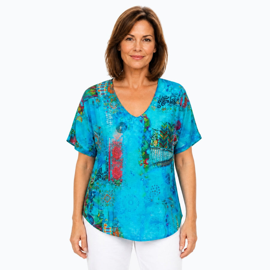 Woman wearing the Claire Powell Paradise V-Neck T-Shirt, front view