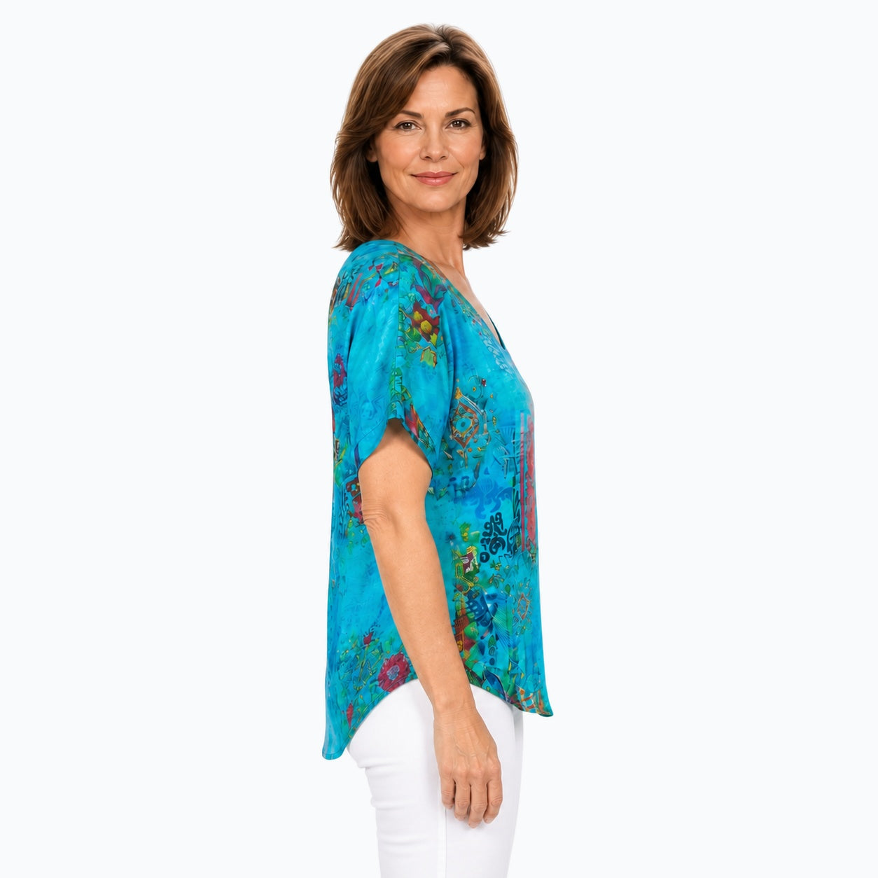 Woman wearing the Claire Powell Paradise V-Neck T-Shirt, side view