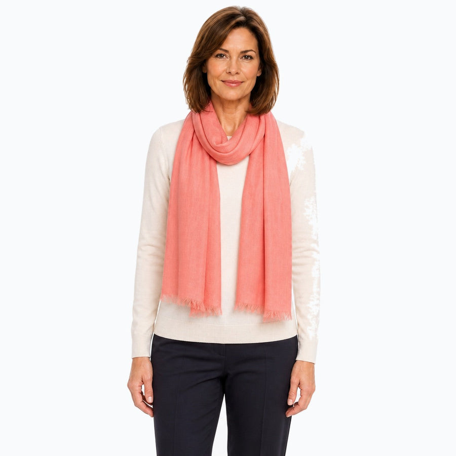 Woman wearing the Claire Powell Peach Silk Wool Scarf, front view