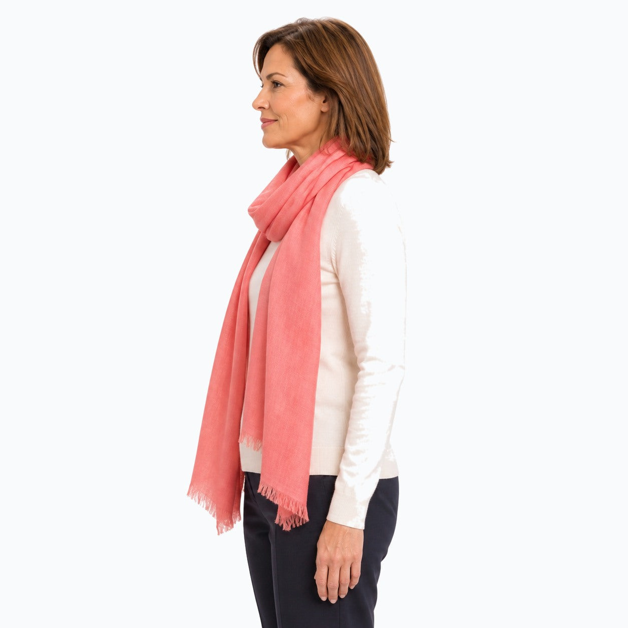 Woman wearing the Claire Powell Peach Silk Wool Scarf, side view