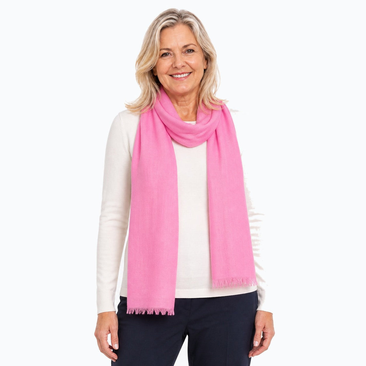 Woman wearing the Claire Powell Pink Silk Wool Scarf, three-quarter view
