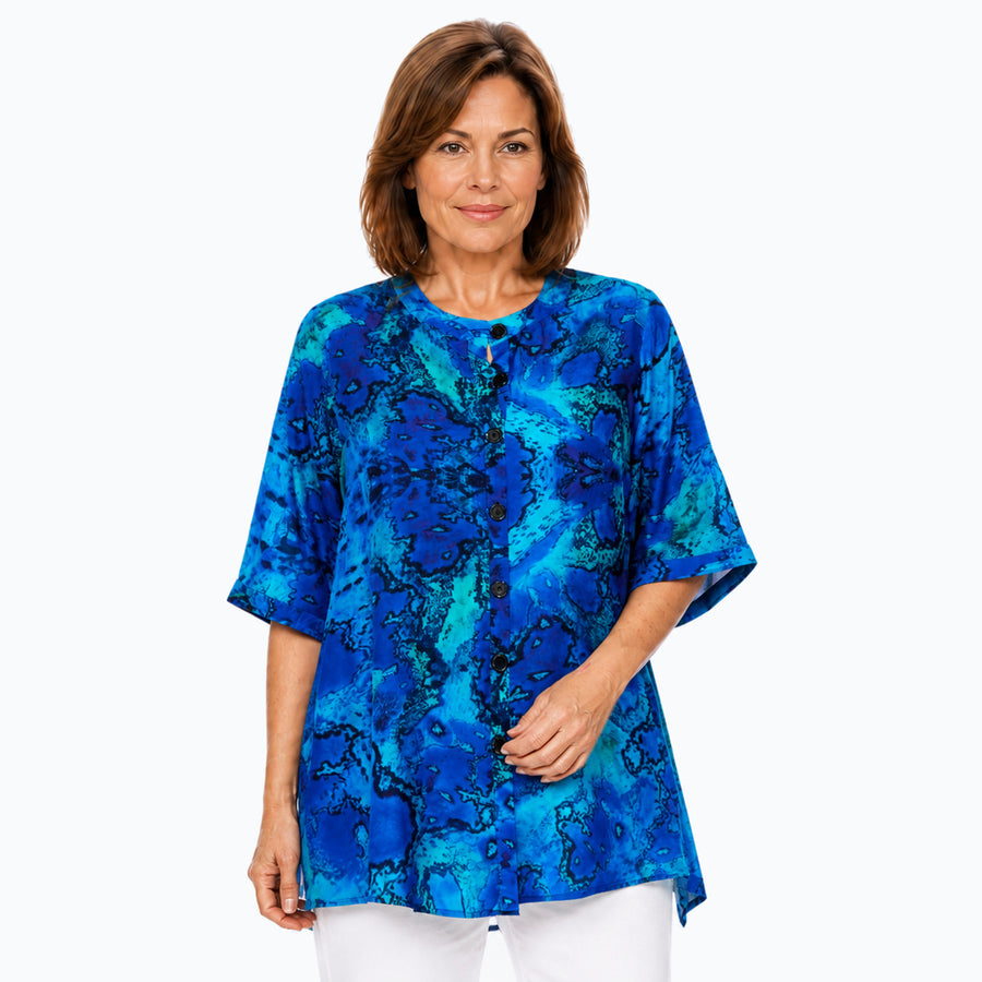 Woman wearing the Claire Powell Reef A-Line Tunic Shirt, front view