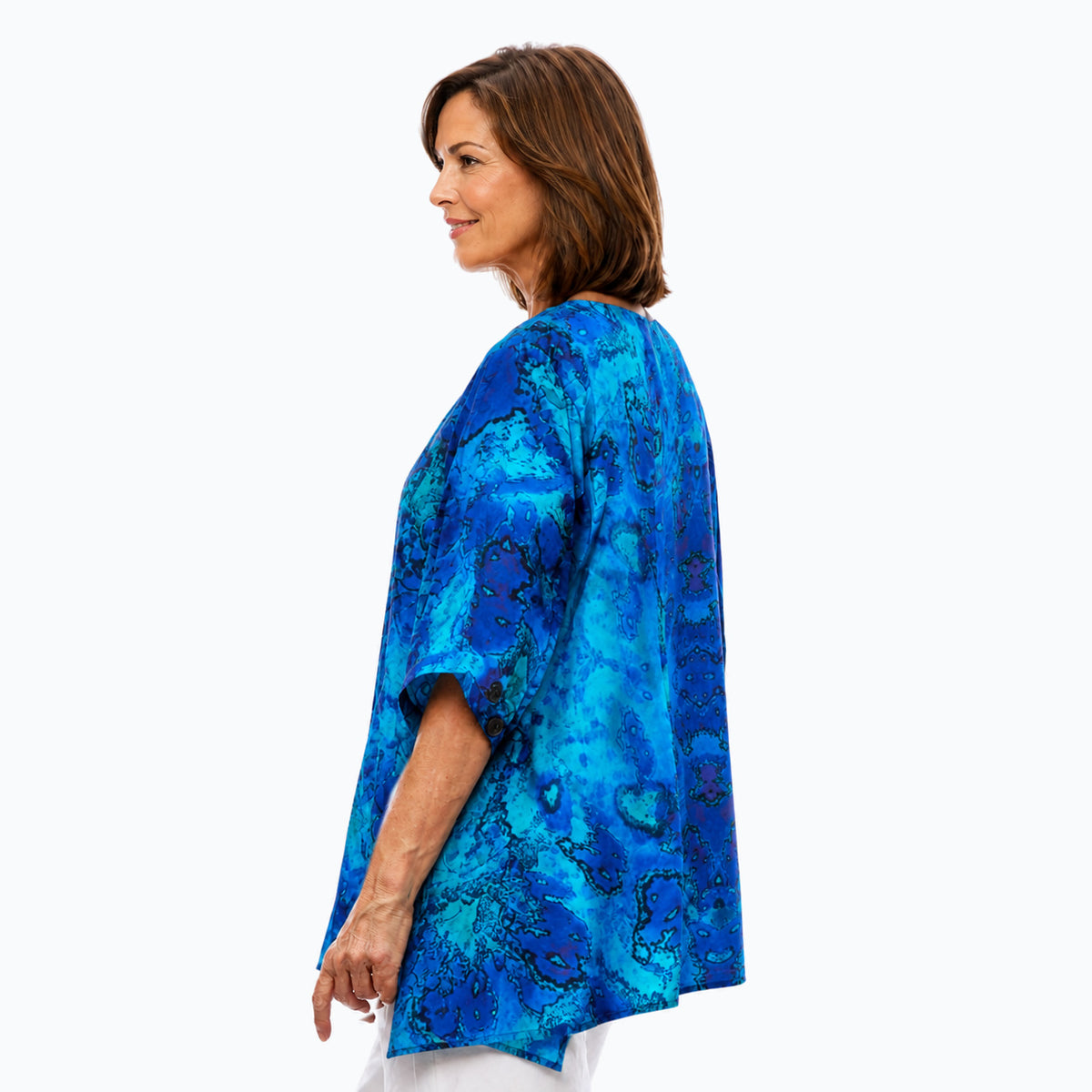 Woman wearing the Claire Powell Reef A-Line Tunic Shirt, side view