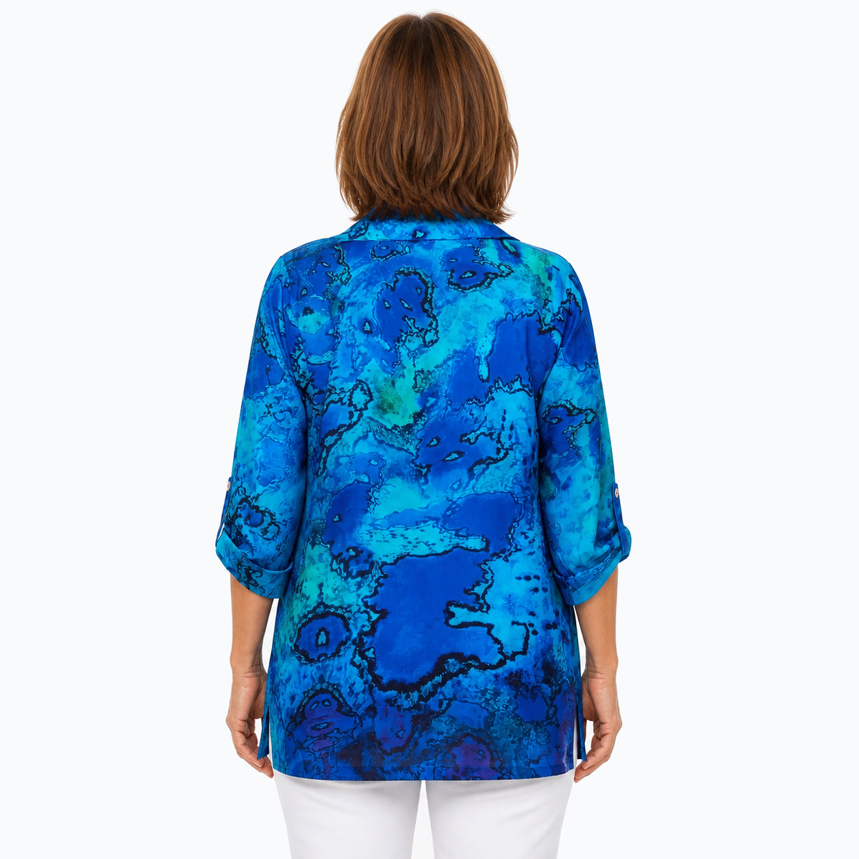 Woman wearing the Claire Powell Reef Collared Silk Shirt, back untucked view