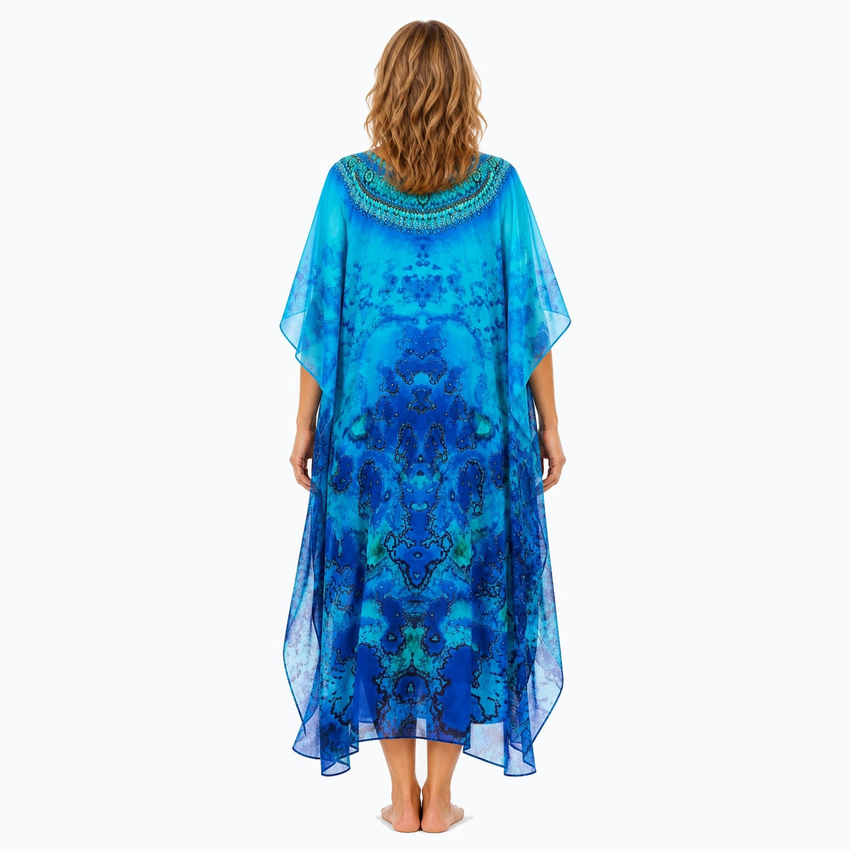 Claire Powell Reef midi kaftan dress on a mature woman, back view