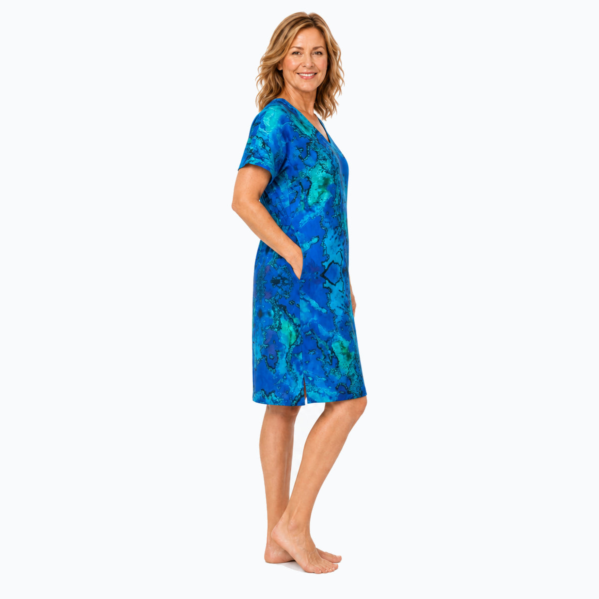 Woman wearing the Claire Powell Reef Shift Dress, side view