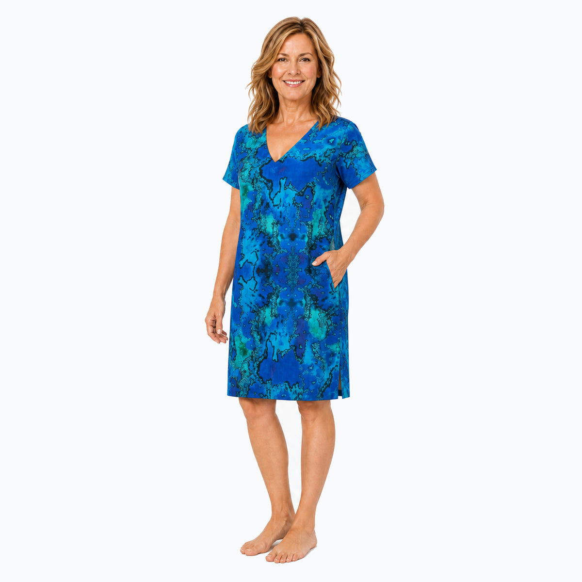 Woman wearing the Claire Powell Reef Shift Dress, three-quarter view