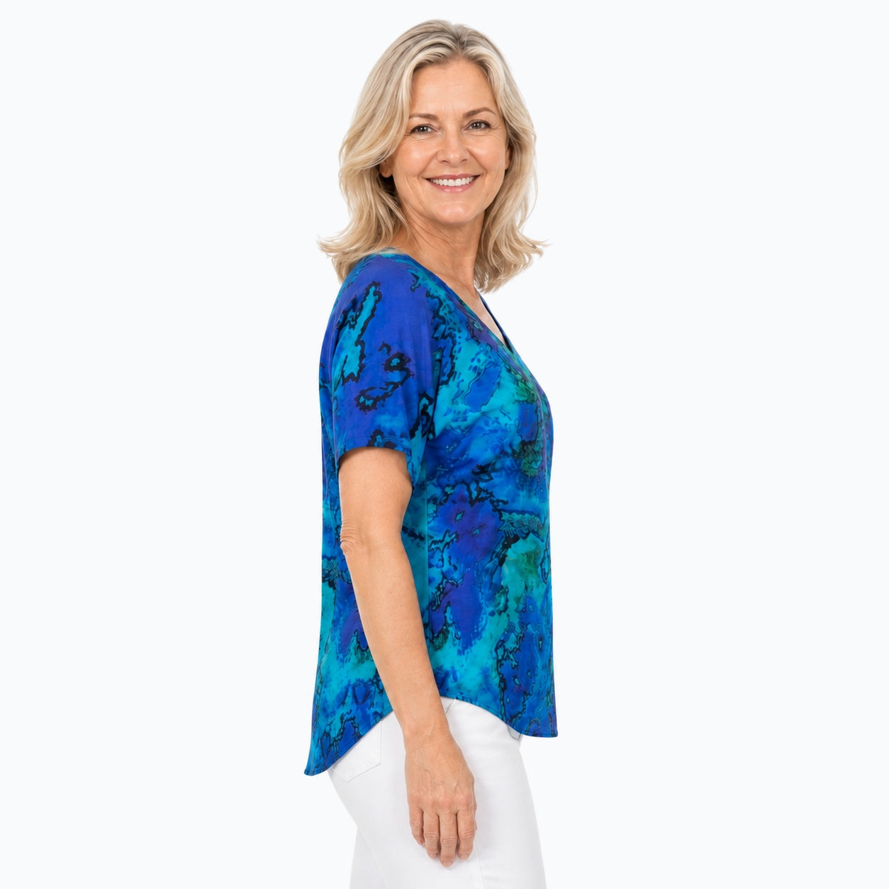 Woman wearing the Claire Powell Reef V-Neck T-Shirt, side view