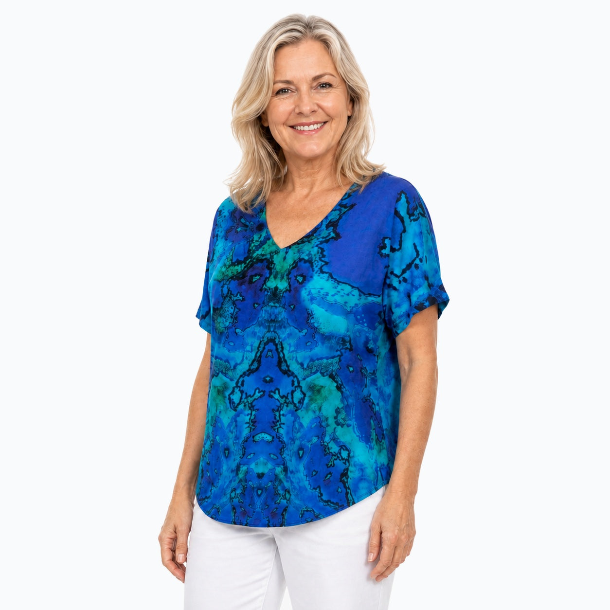 Woman wearing the Claire Powell Reef V-Neck T-Shirt, three-quarter view