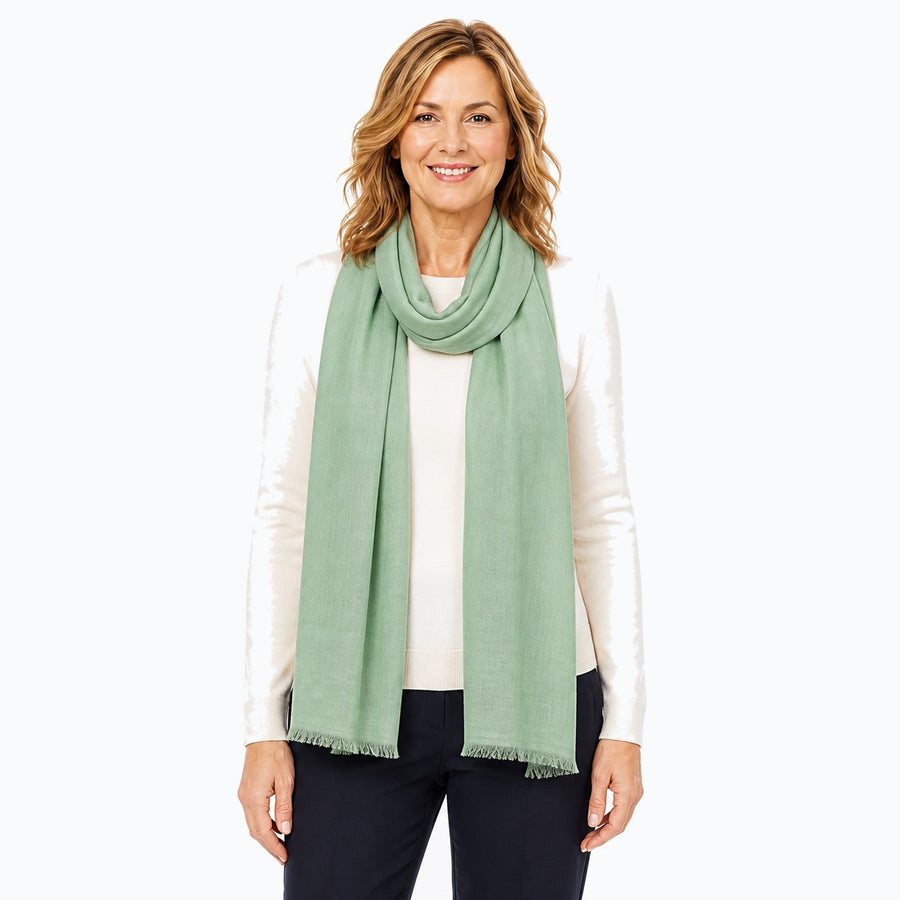Woman wearing the Claire Powell Sage Silk Wool Scarf, front view