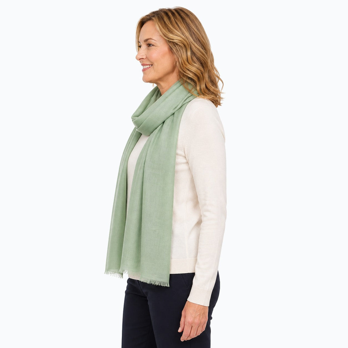 Woman wearing the Claire Powell Sage Silk Wool Scarf, side view