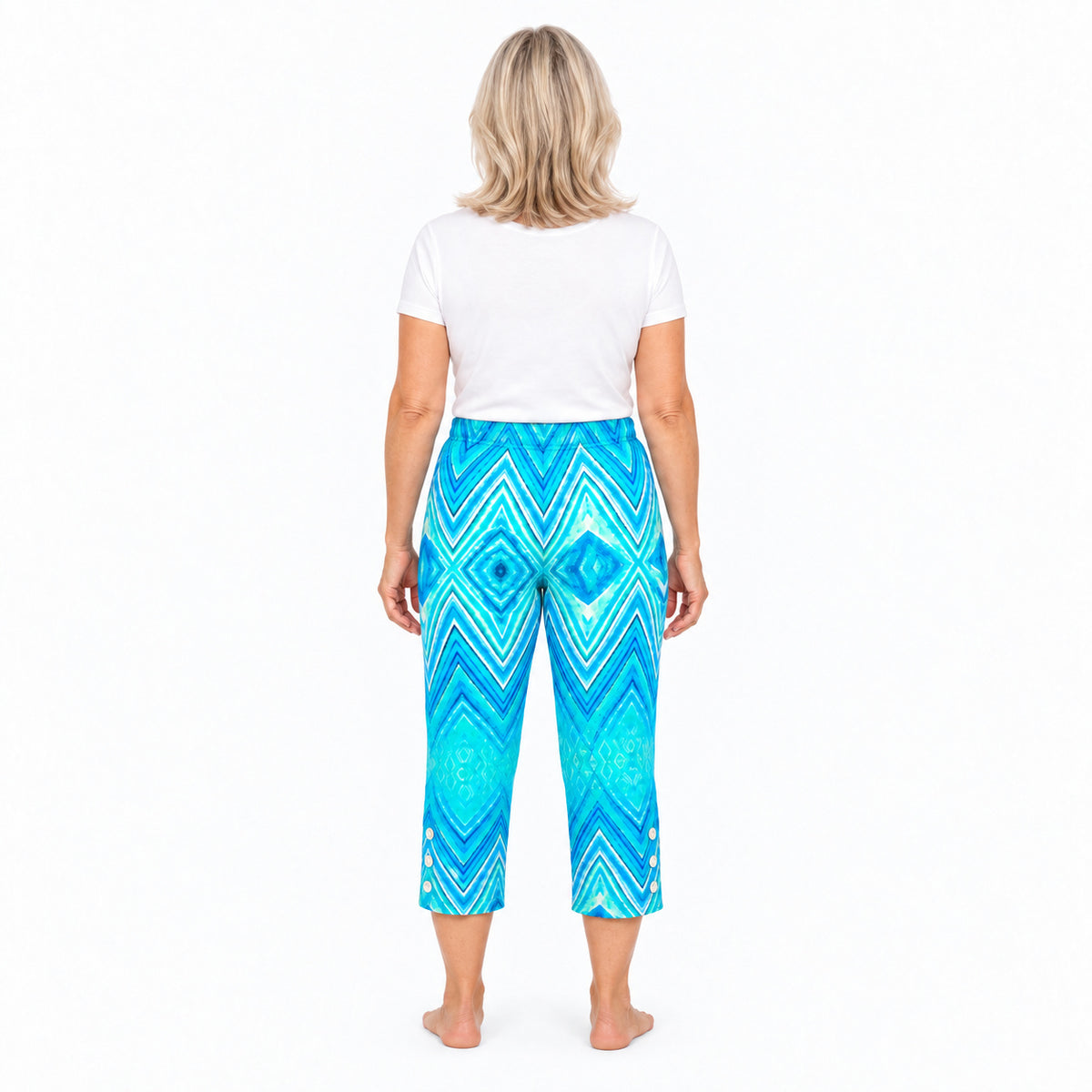Woman wearing Claire Powell Serenity capri pants, back view