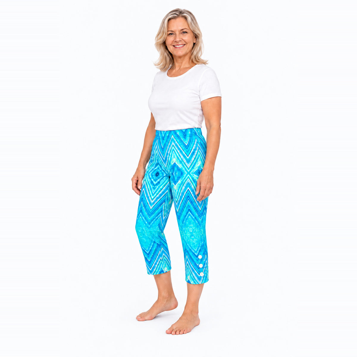 Woman wearing Claire Powell Serenity capri pants, three-quarter view