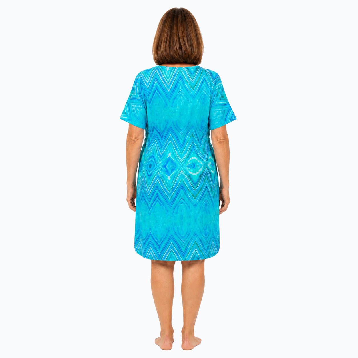 Woman wearing the Claire Powell Serenity Shift Dress, back view