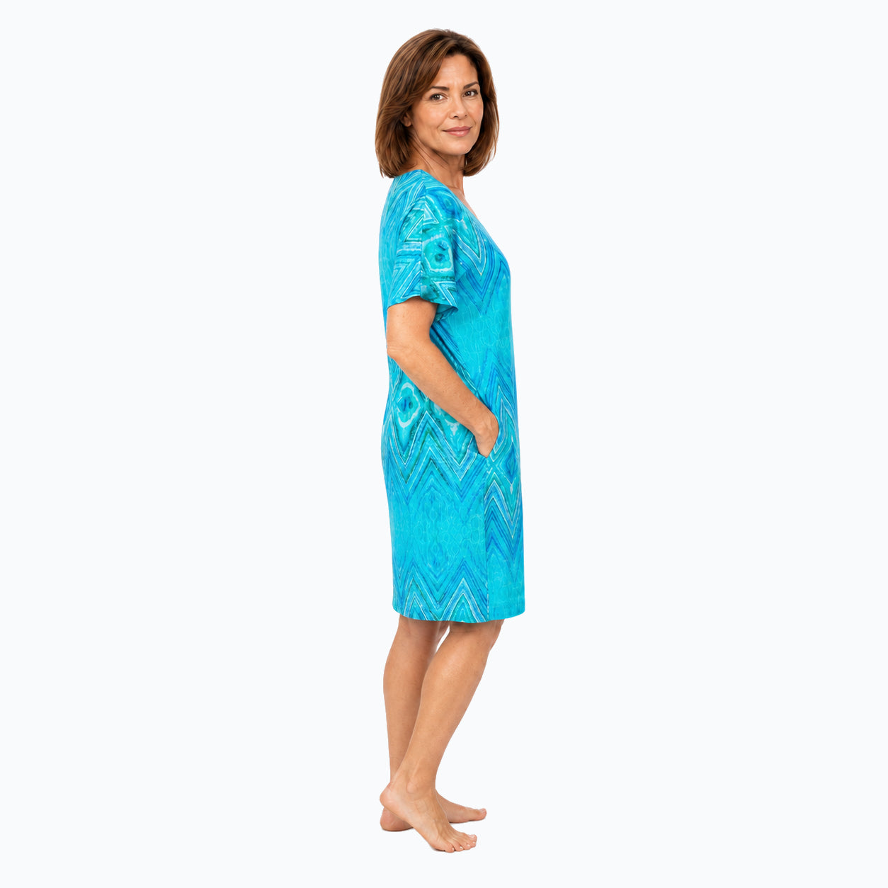 Woman wearing the Claire Powell Serenity Shift Dress, side view