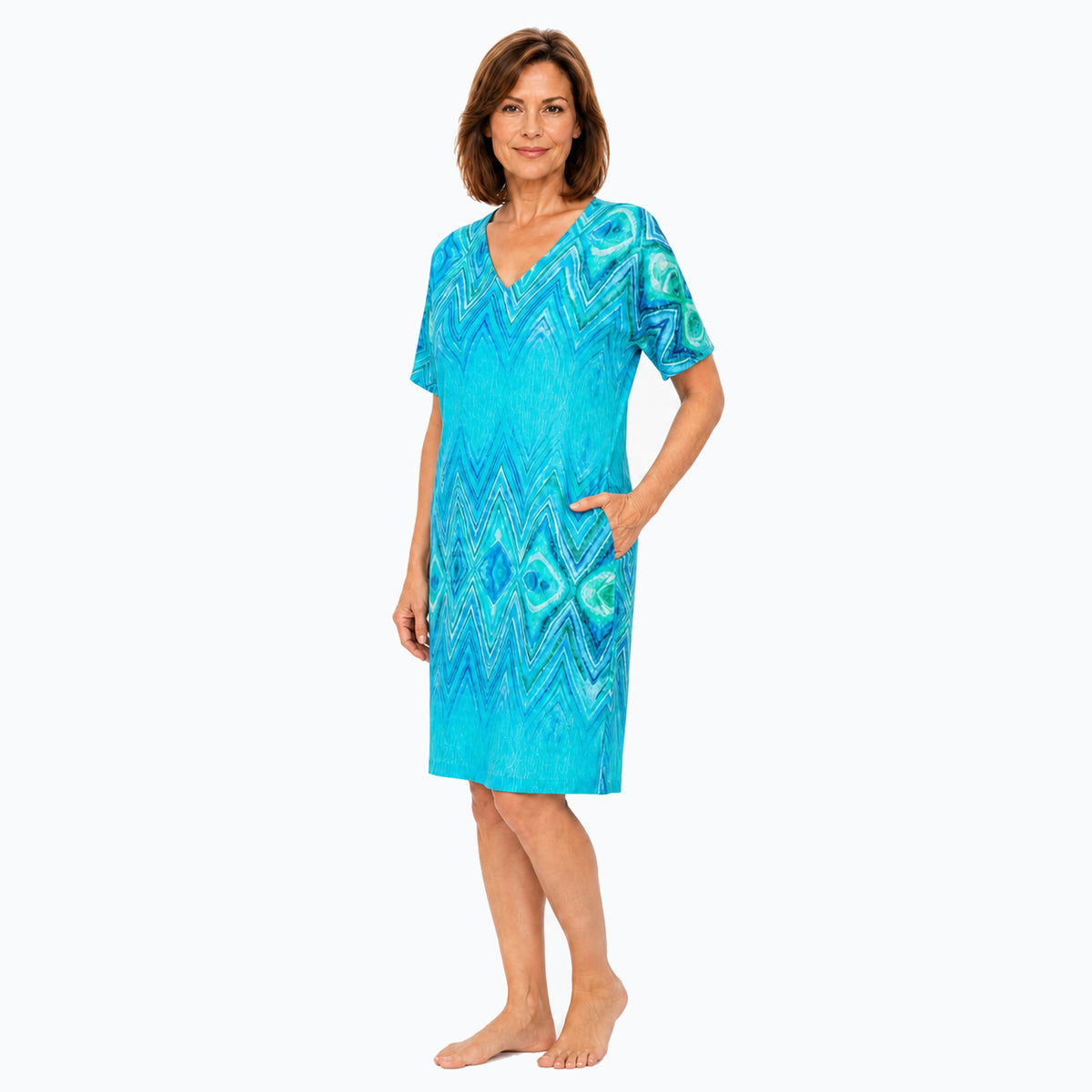 Woman wearing the Claire Powell Serenity Shift Dress, three-quarter view