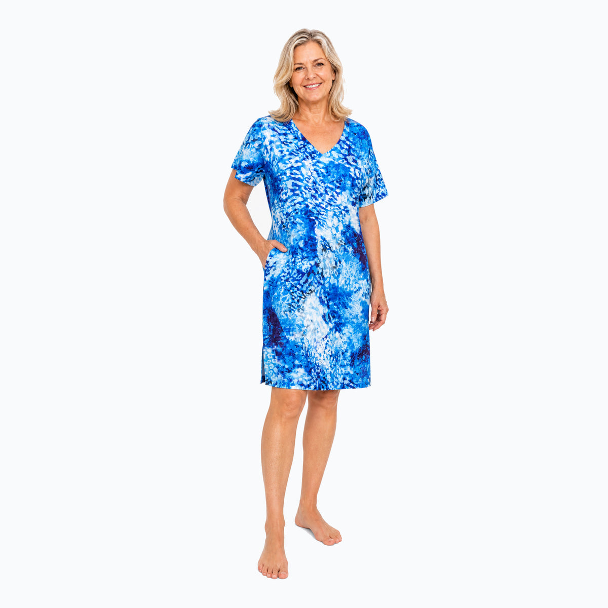 Woman wearing the Claire Powell Snowcat Shift Dress, three-quarter view