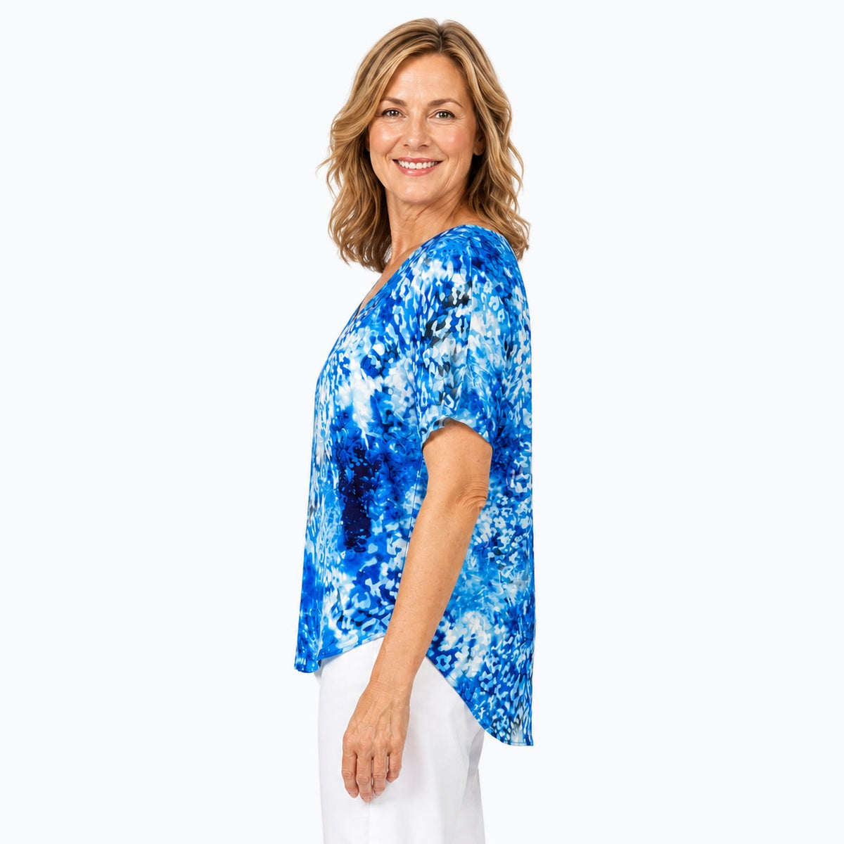Woman wearing the Claire Powell Snowcat V-Neck T-Shirt, side view