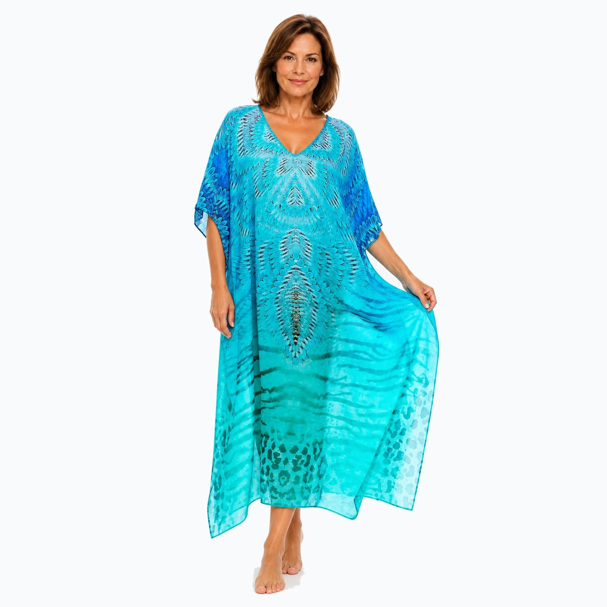 Claire Powell Spray midi kaftan dress on a mature woman, fabric-showing pose