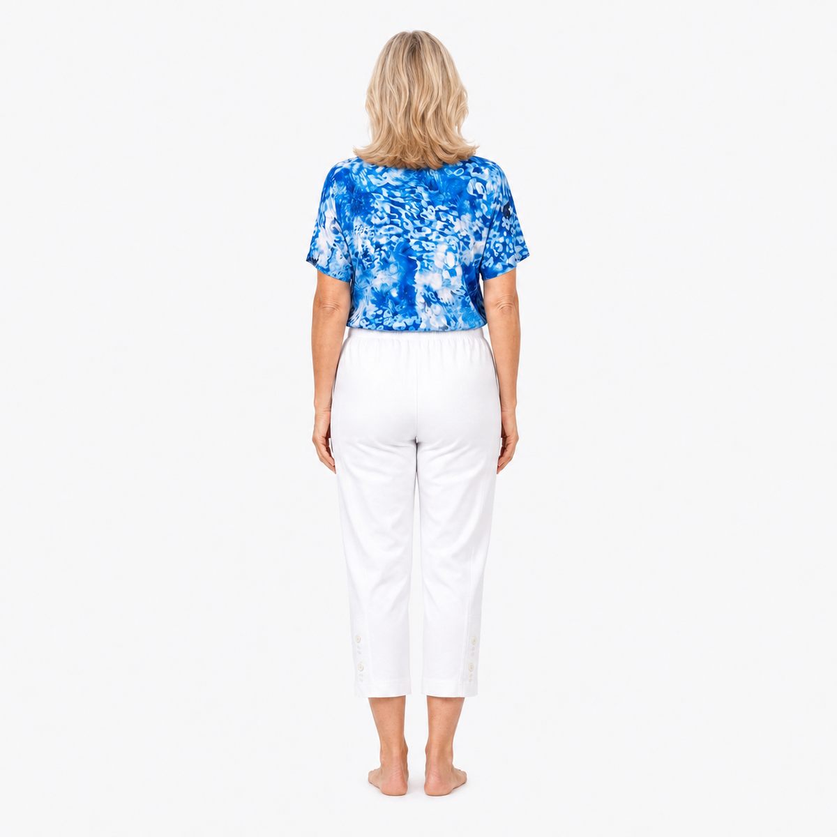 Approved Model B wearing Claire Powell White Cotton Lycra Capri Pants, barefoot back view