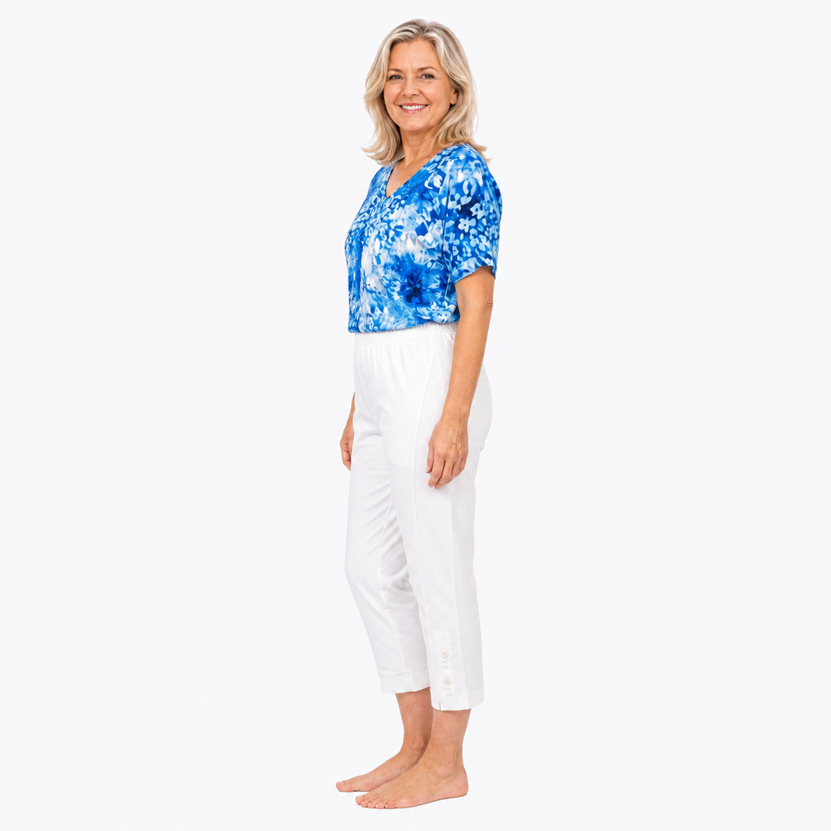 Approved Model B wearing Claire Powell White Cotton Lycra Capri Pants, barefoot side view