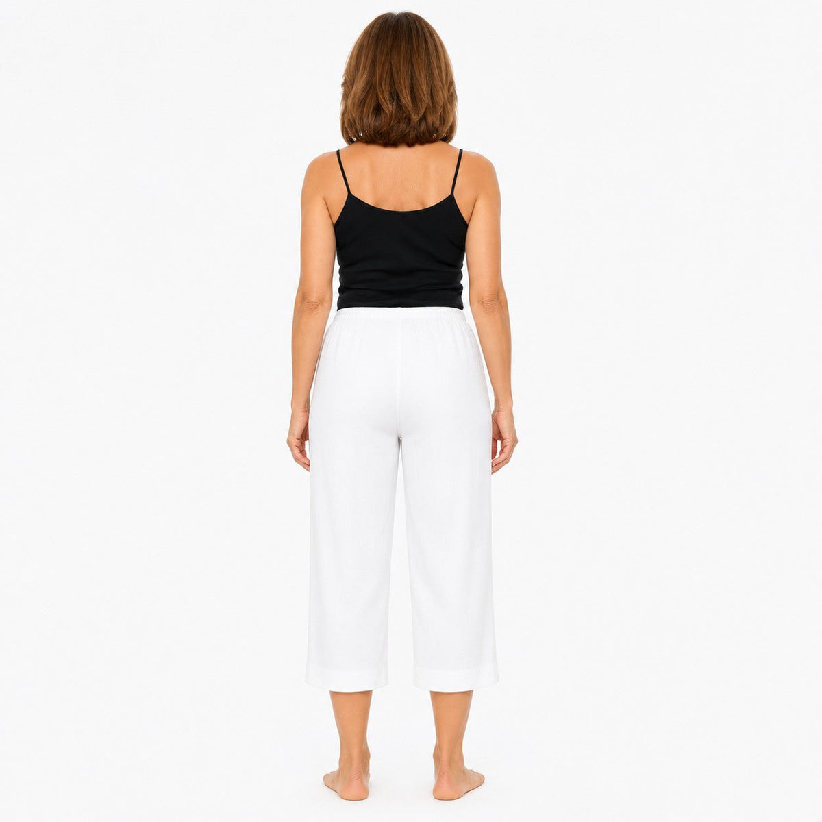 Woman wearing the Claire Powell White Viscose 7/8 Pants, back view