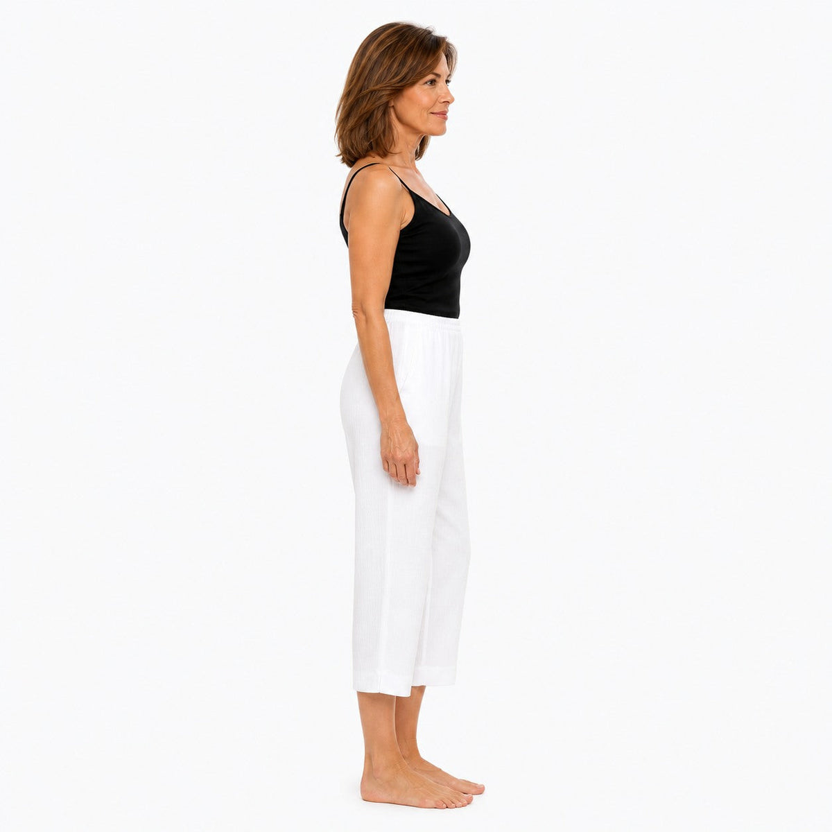 Woman wearing the Claire Powell White Viscose 7/8 Pants, side view