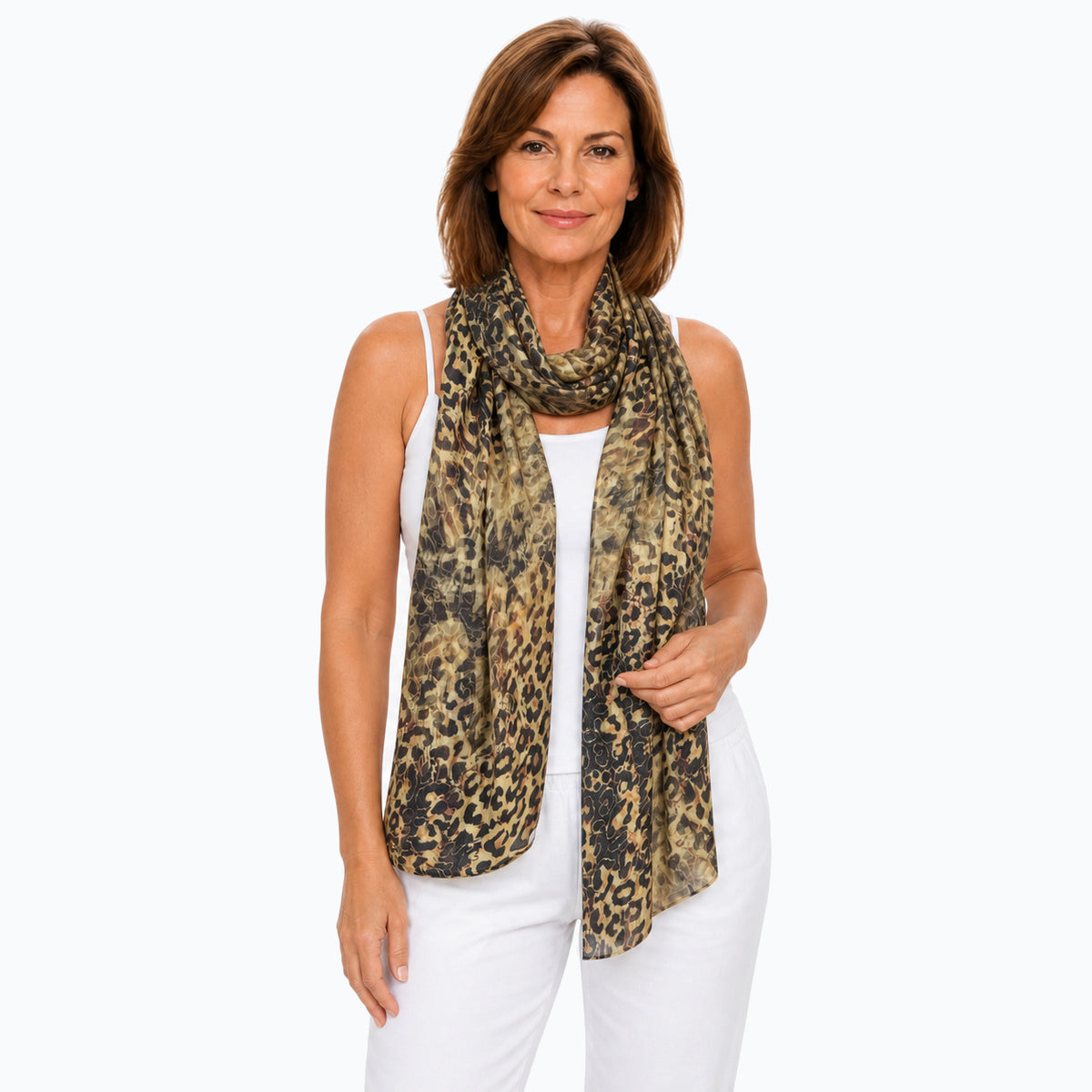 Woman wearing the Claire Powell Wilden scarf, neck wrap view with white camisole and white capri pants