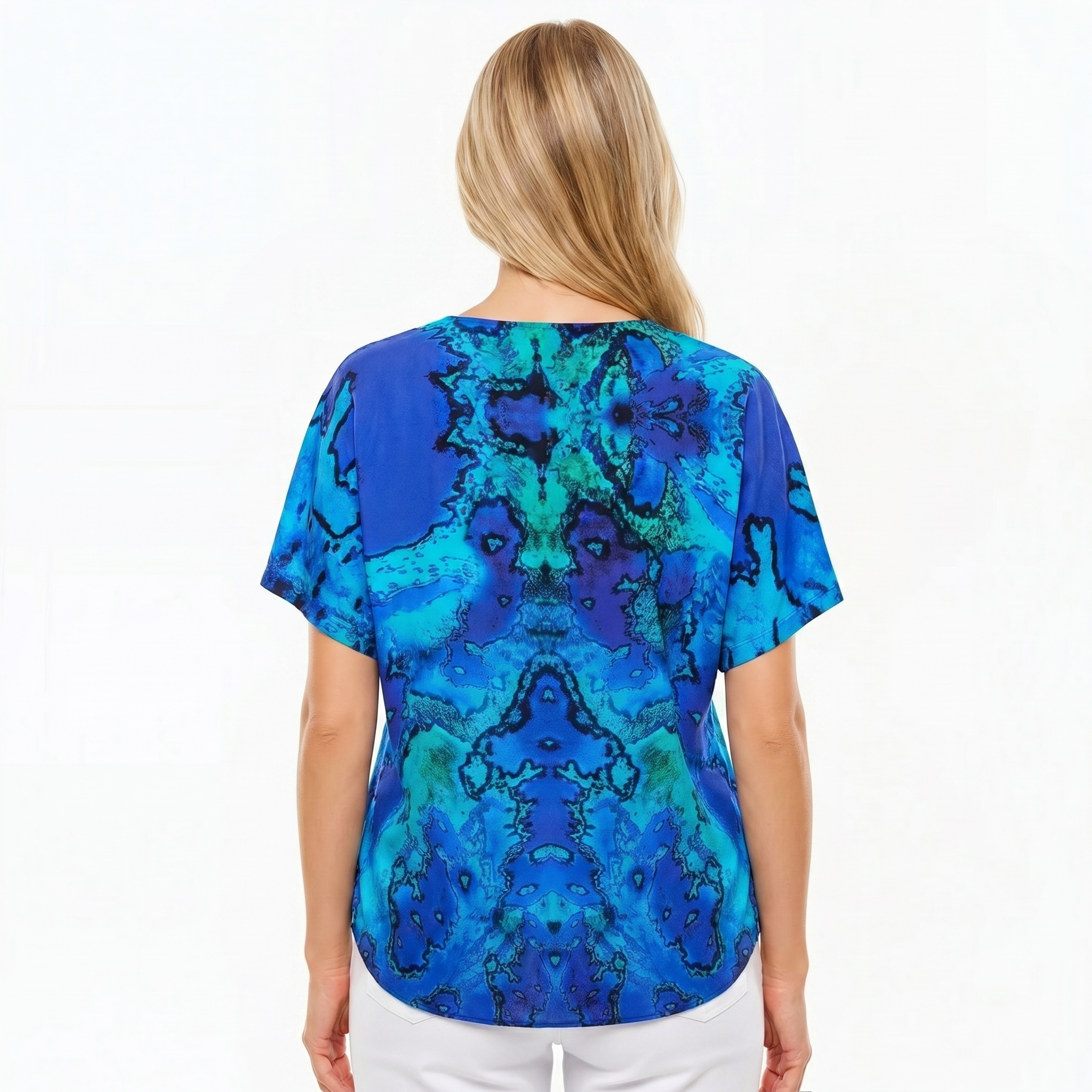 Woman wearing Claire Powell V-Neck T-Shirt in Reef print, back view, white studio background