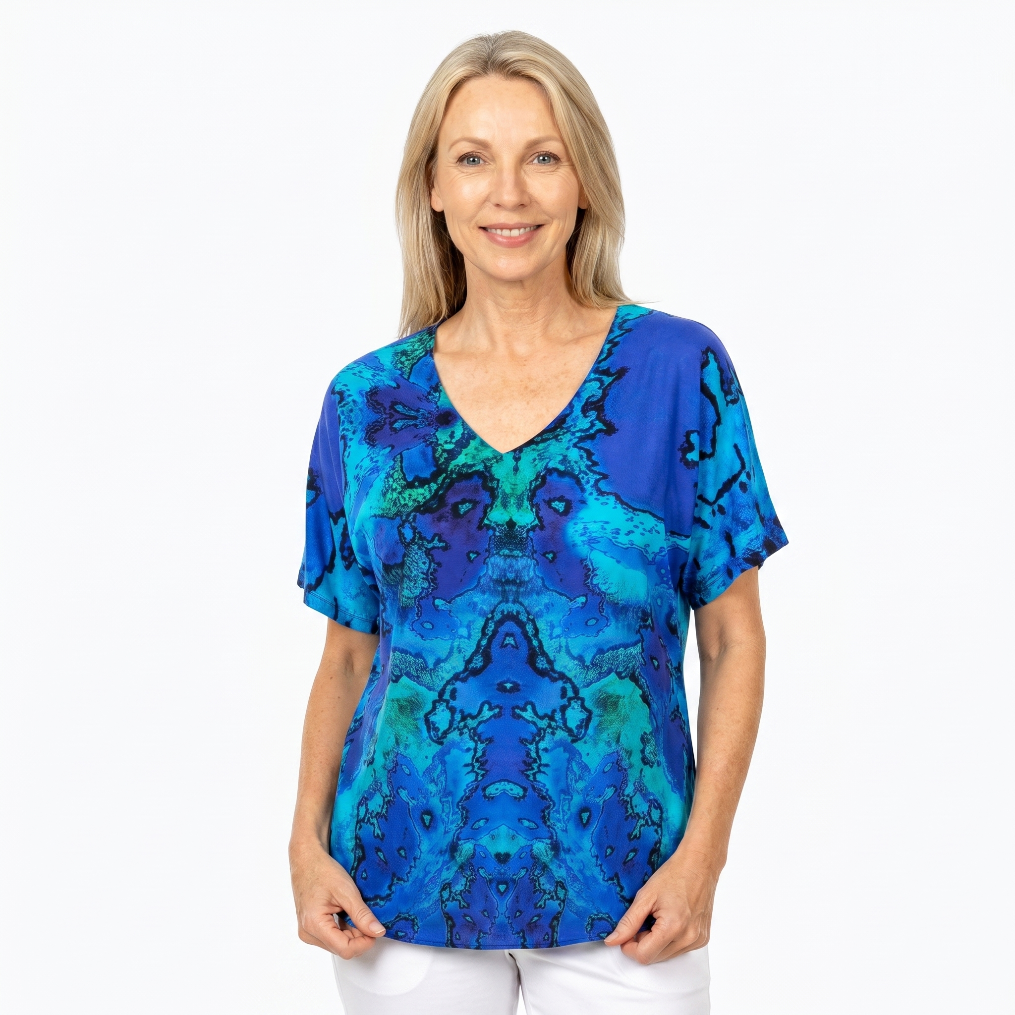 Woman wearing Claire Powell V-Neck T-Shirt in Reef print, front view, white studio background