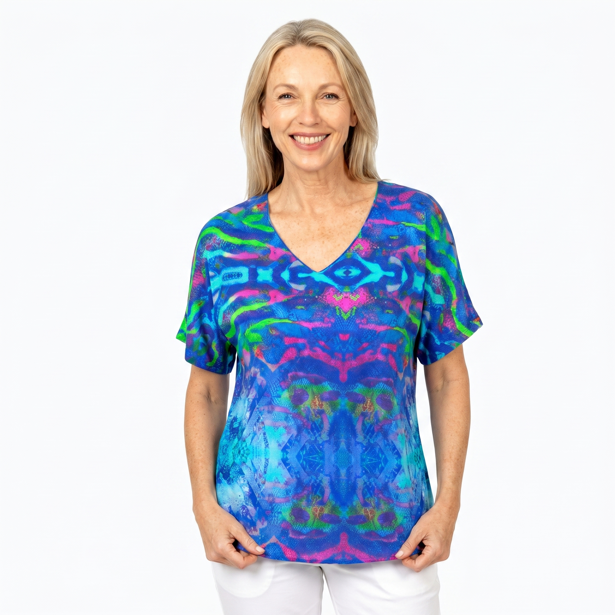 Woman wearing Claire Powell V-Neck T-Shirt in Mirage print, front view, white studio background