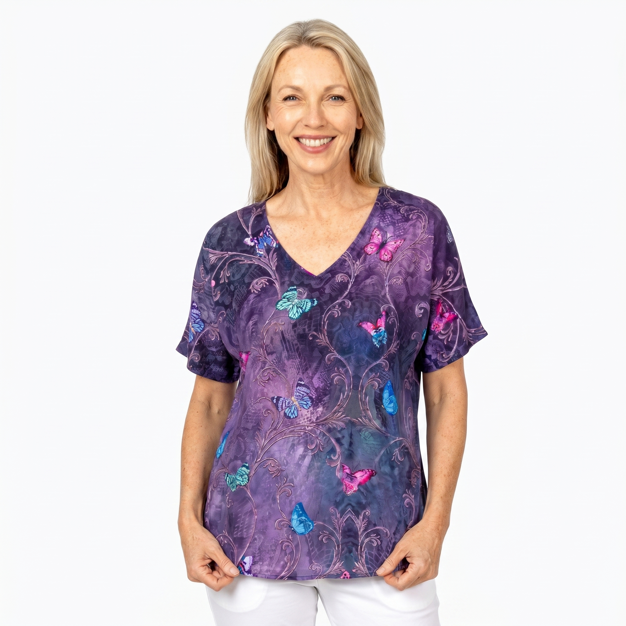 Woman wearing Claire Powell V-Neck T-Shirt in Enchanted print, front view, white studio background