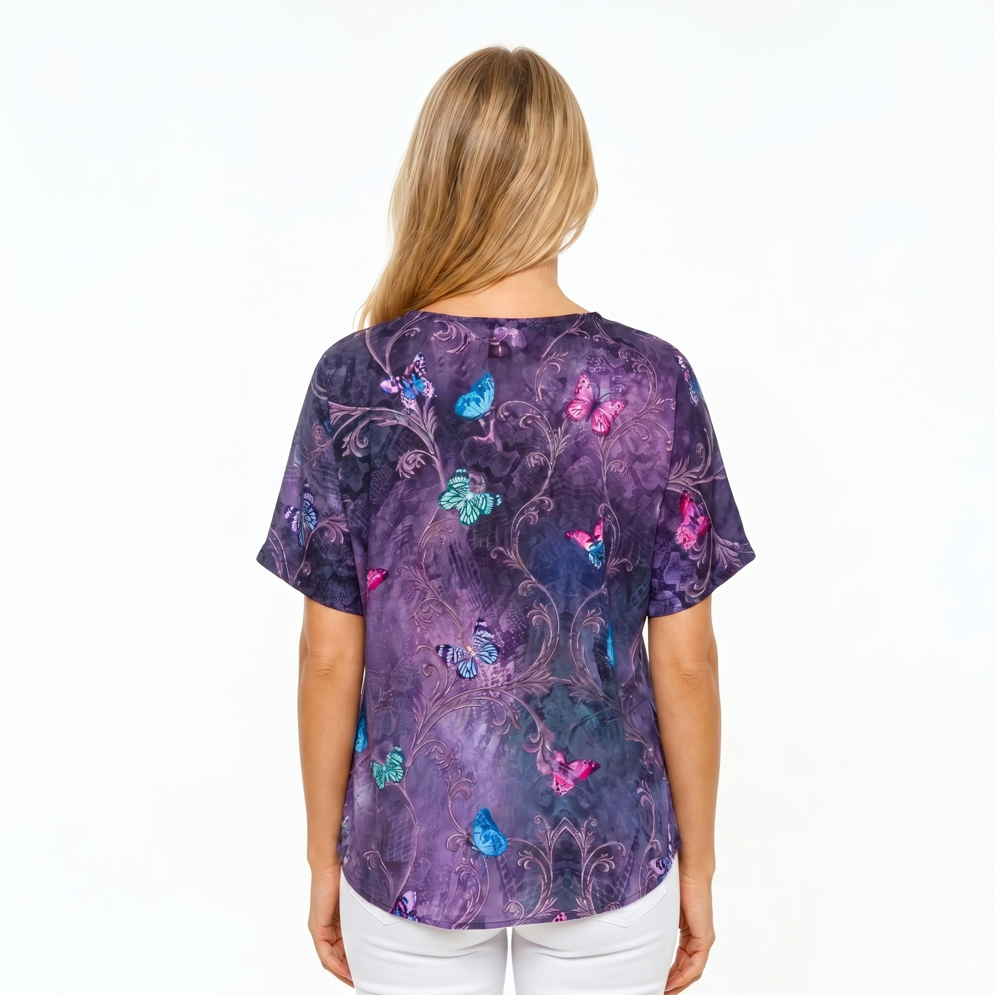 Woman wearing Claire Powell V-Neck T-Shirt in Enchanted print, back view, white studio background