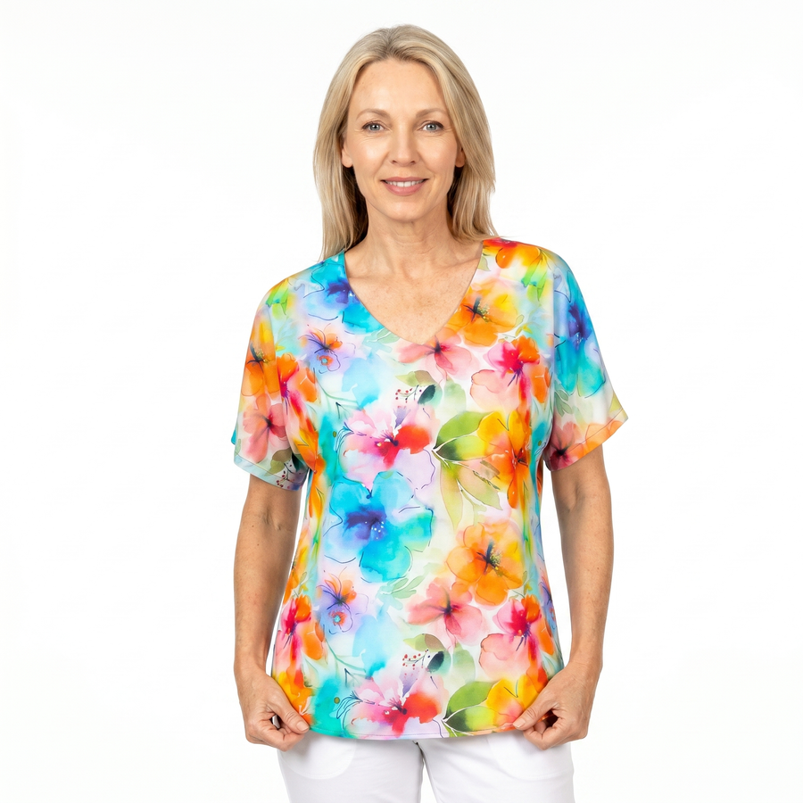 Woman wearing Claire Powell V-Neck T-Shirt in Blushing print, front view, white studio background