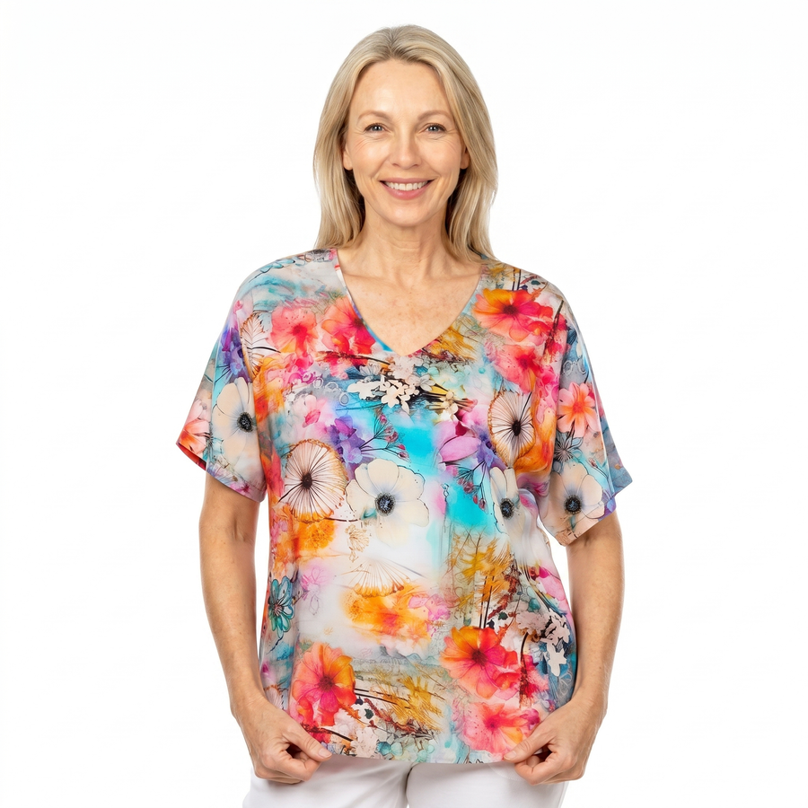 Woman wearing Claire Powell V-Neck T-Shirt in Zen print, front view, white studio background