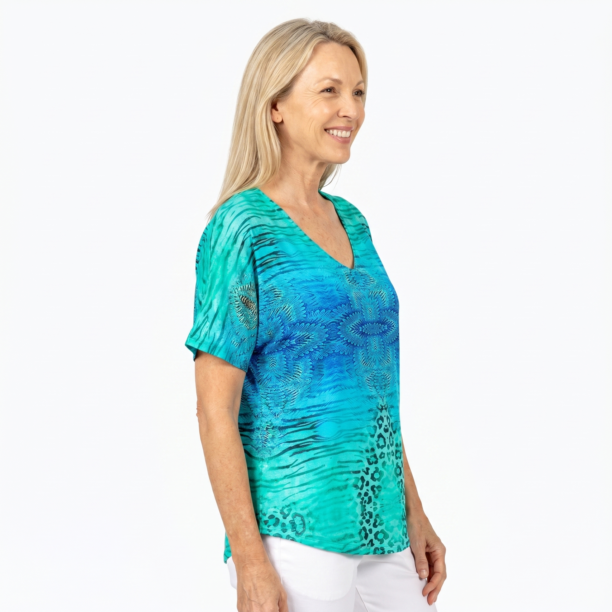 Woman wearing Claire Powell V-Neck T-Shirt in Spray print, side view, white studio background