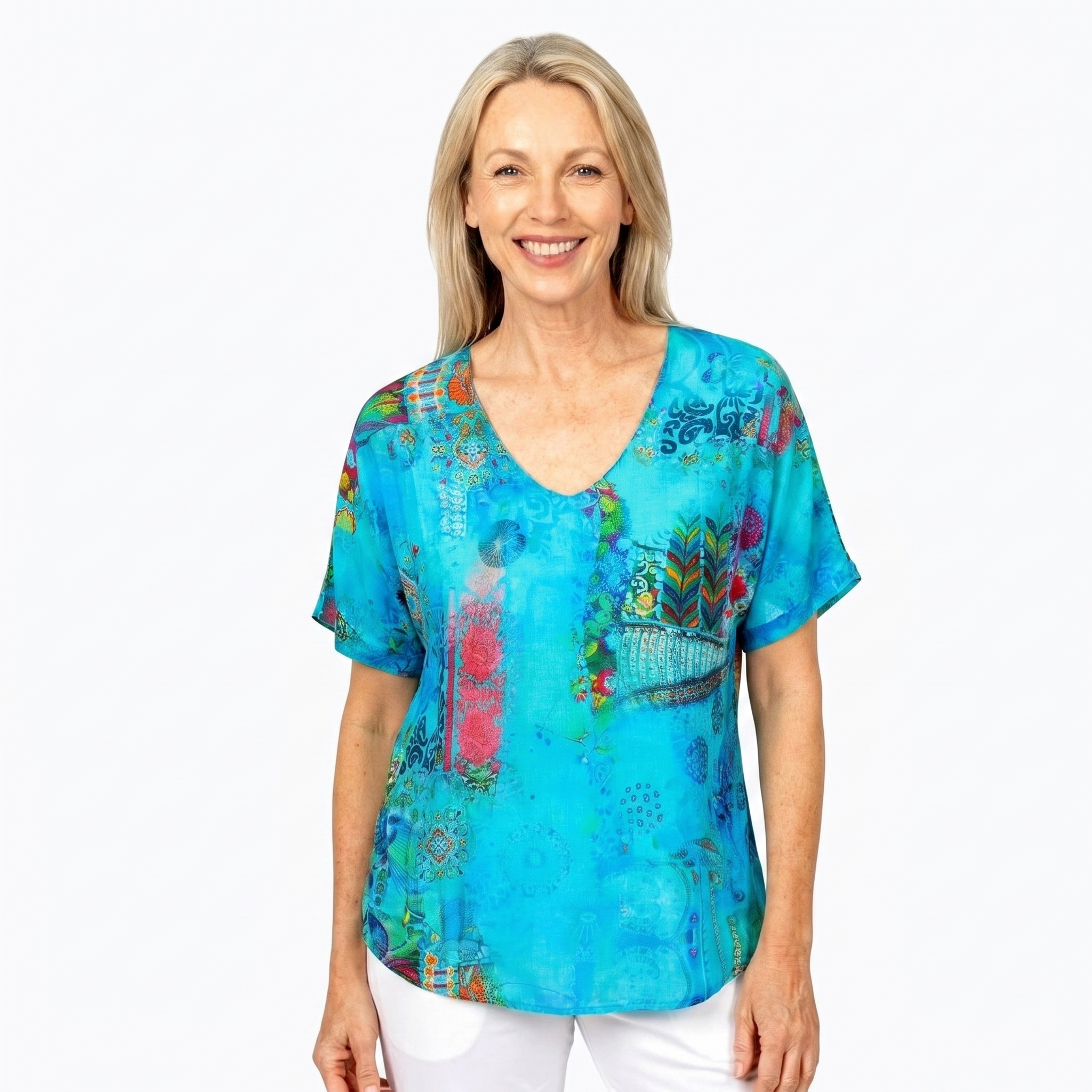 Woman wearing Claire Powell V-Neck T-Shirt in Paradise print, front view, white studio background