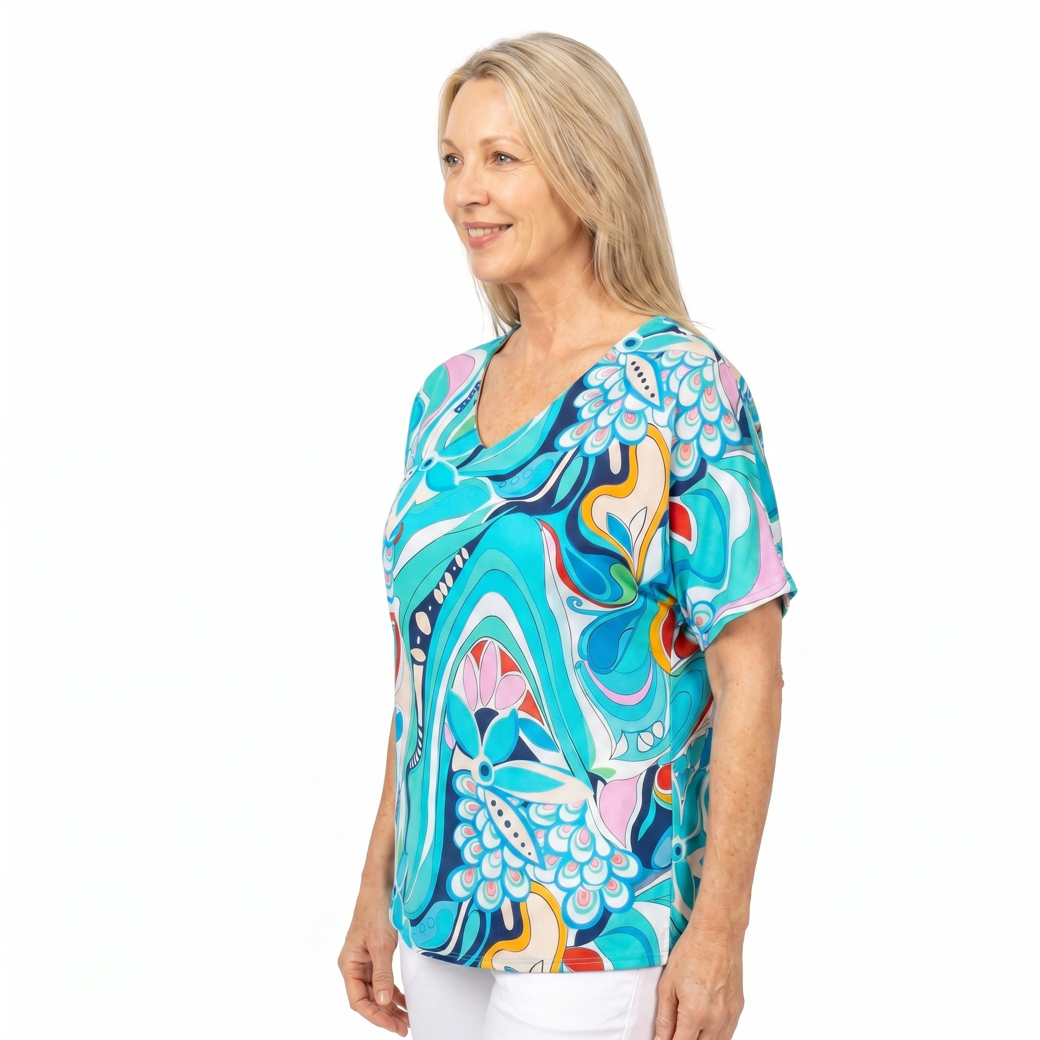 Woman wearing Claire Powell V-Neck T-Shirt in Sakura print, side view, white studio background