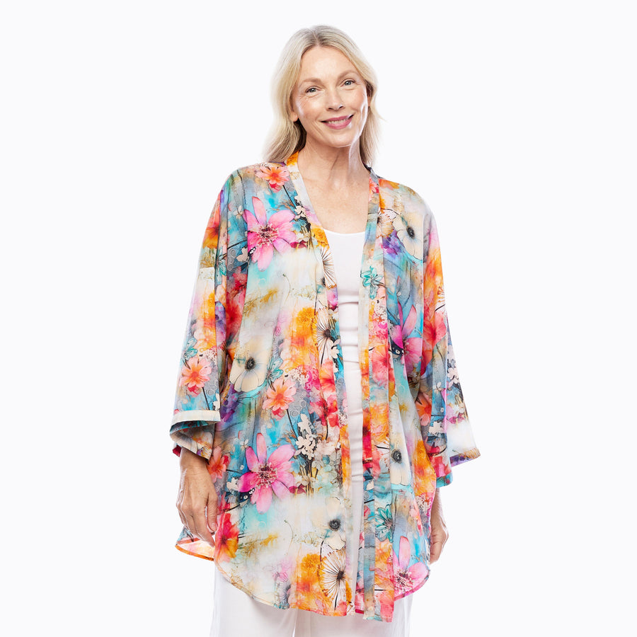 Woman wearing Claire Powell Modal Kimono Cover-Up in Zen print, colourful floral, front view