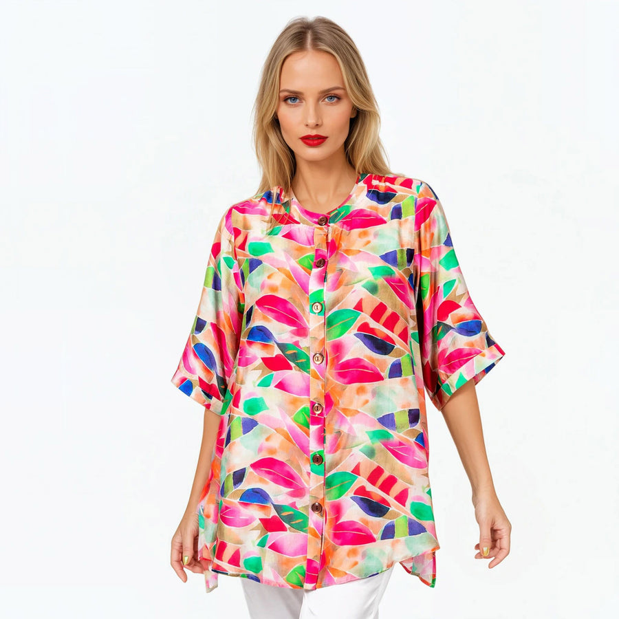 Woman wearing Claire Powell A-line Tunic Blouse in La Peach print, peach, apricot and coral, front view, alternate pose